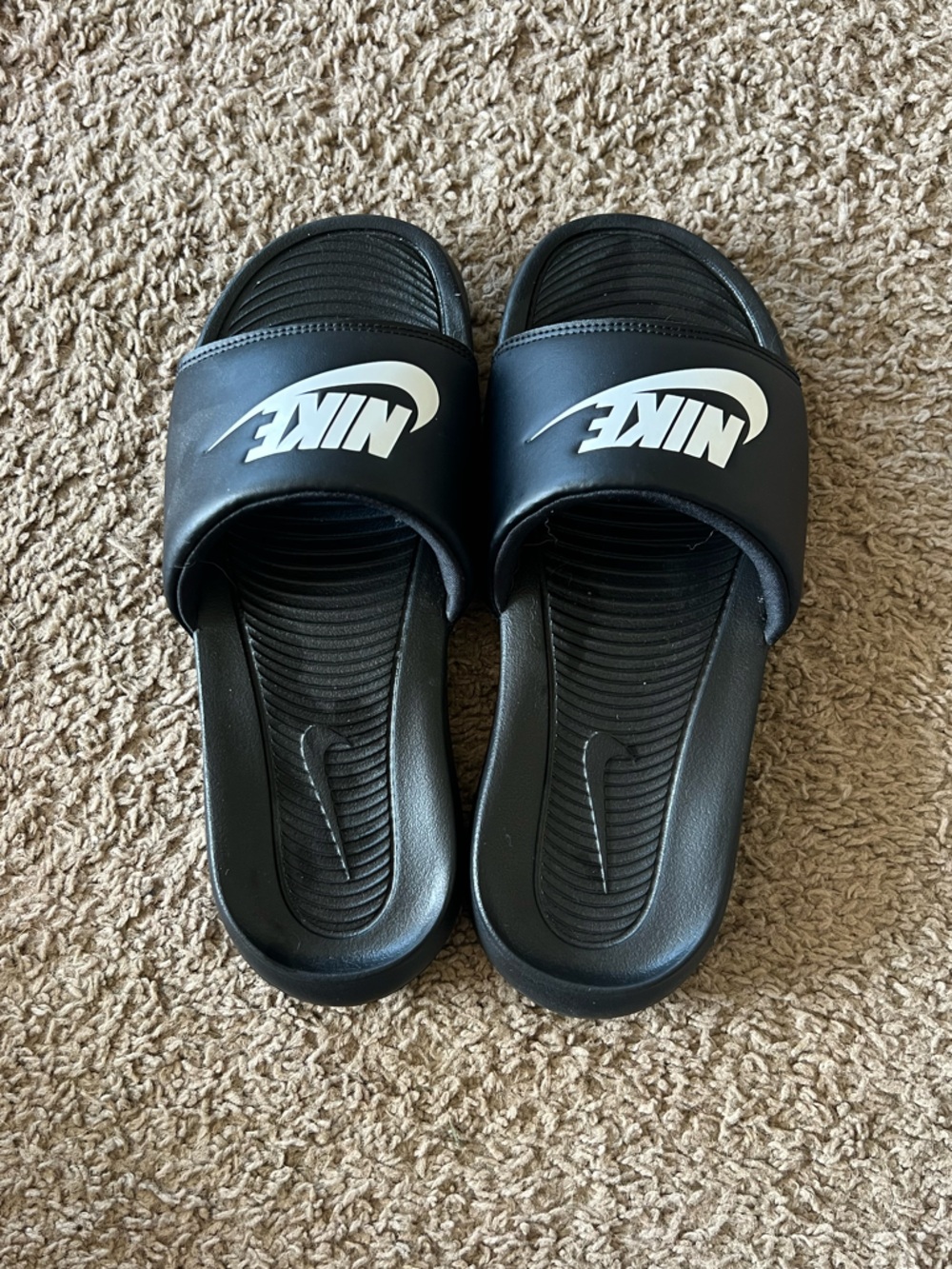 Nike Black Slides with White Swoosh Logo